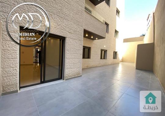 شقة شبه ارضي جديدة للبيع تلاع العلي مساحة 200م 4 نوم مع ترس و حديقة 150م تشطيبات سوبر ديلوكس 