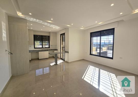 عبدون شقة ارضية للإيجار مع تراس وكراج خاص 2 نوم 