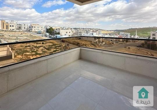 شقة في حي المنصور تشطيب فلل كهرباء مجانية و تدفئة راكبة 