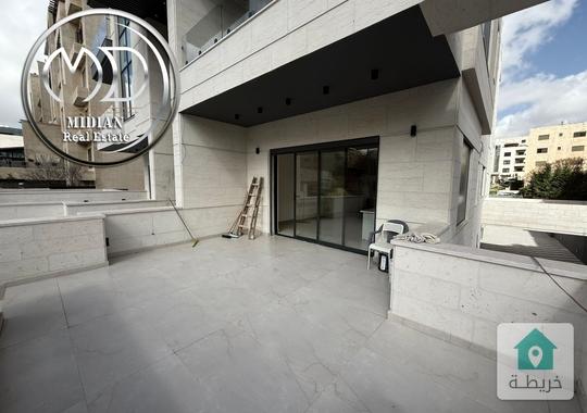 شقة ارضية للبيع دير غبار مساحة 185م مع ترس 100م تشطيبات و ديكورات عصرية فاخرة جديدة لم تسكن